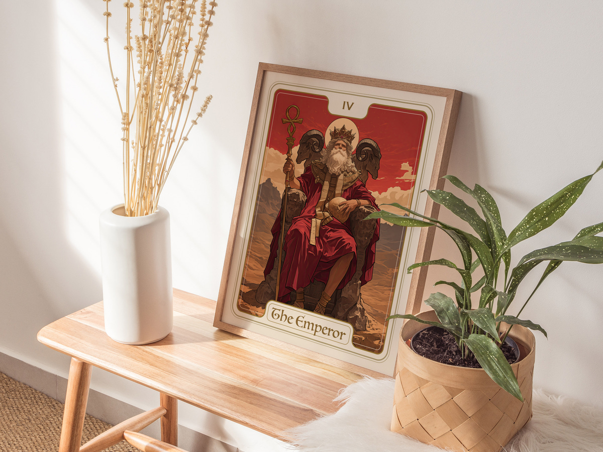 A framed art print titled The Emperor features a regal figure seated on a throne, surrounded by two imposing figures. The background showcases a mountainous landscape with warm, earthy tones, enhancing the artworks majestic vibe.