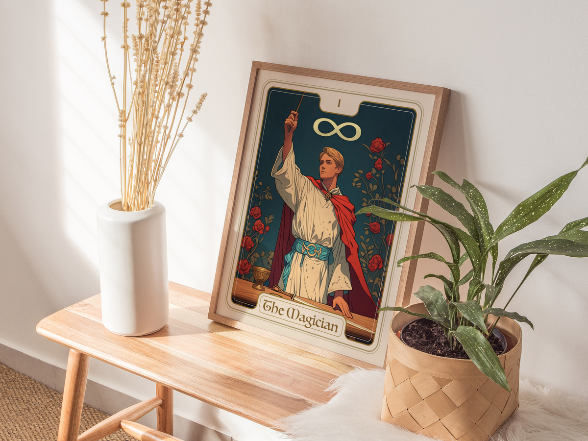 A framed art print titled The Magician features a figure in a white robe and red cape, holding a wand and surrounded by roses and an infinity symbol.