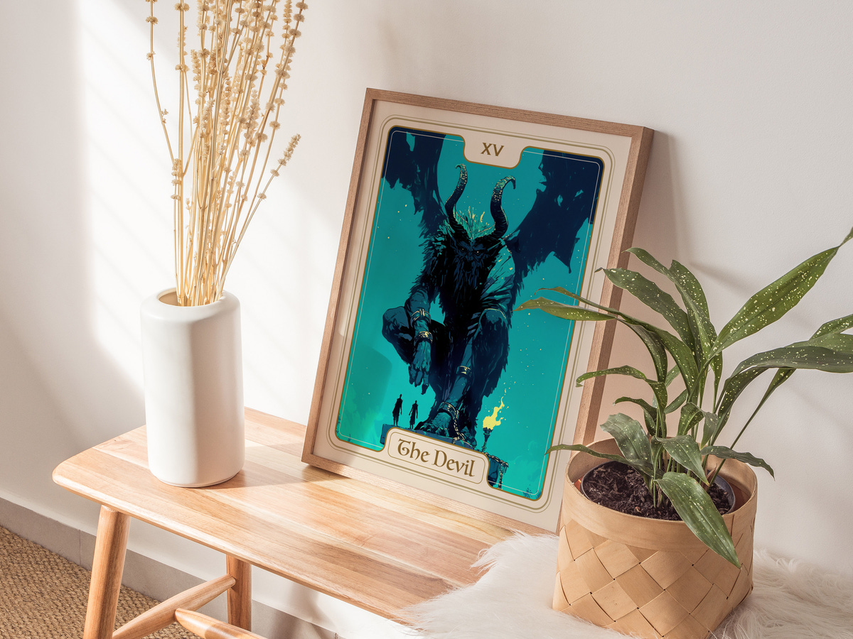 A framed art print titled The Devil features a large, horned figure seated on a rocky pedestal, surrounded by shadowy figures.