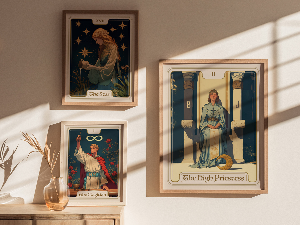 Three tarot cards are displayed in stylish wooden frames on a light-colored wall. The central card features The High Priestess, depicting a serene woman seated between two pillars, surrounded by symbolic imagery, while the other.