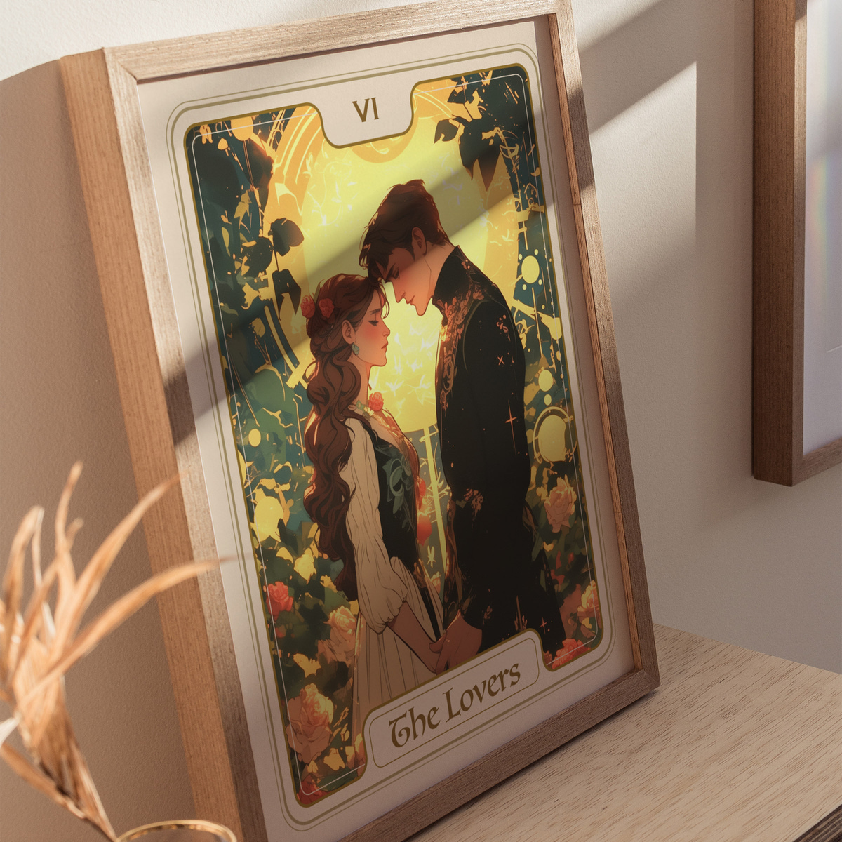 A framed illustration of The Lovers tarot card features a couple standing close together, their foreheads touching, surrounded by lush greenery.